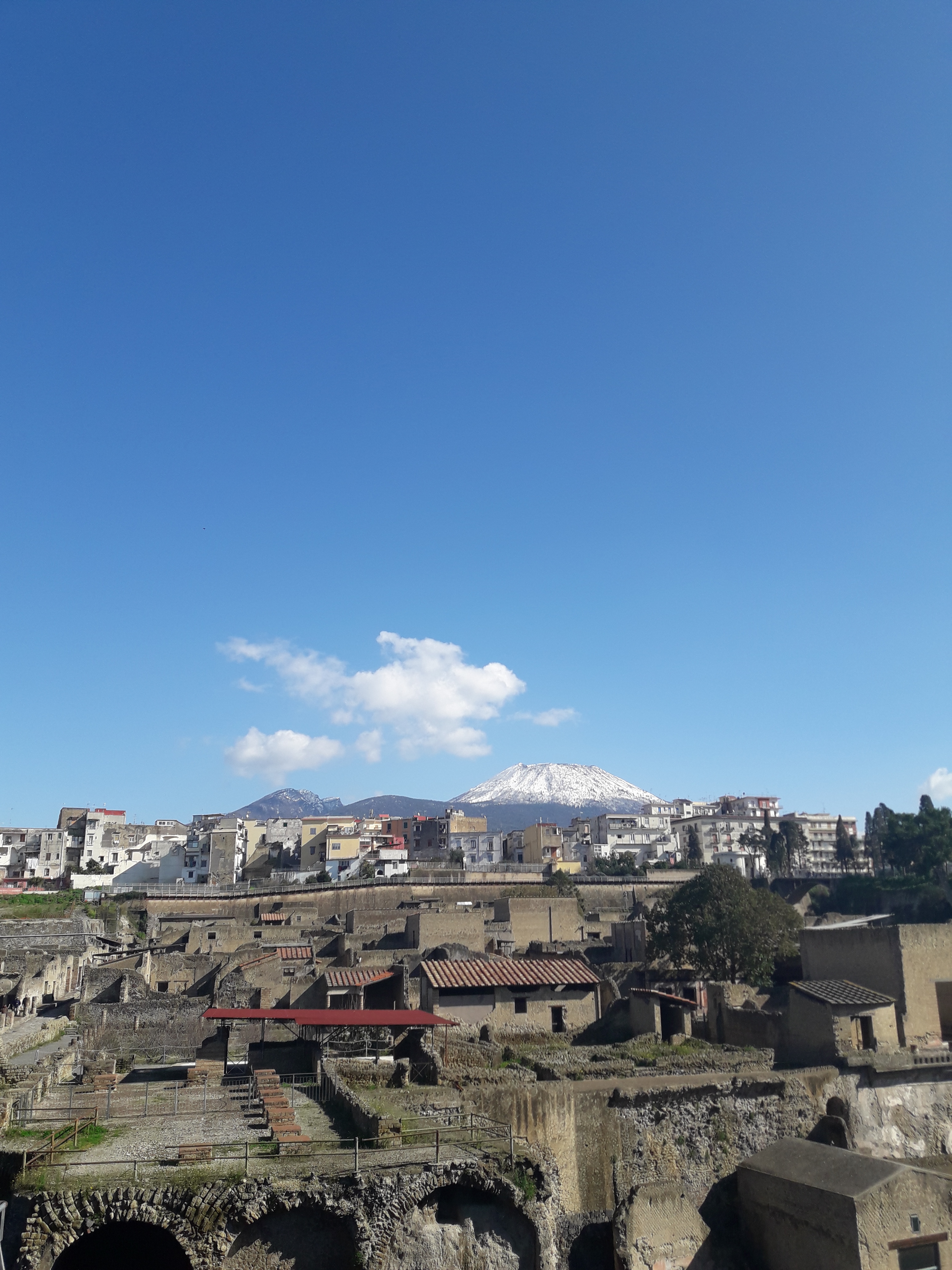 Herculaneum: the ancient
                city seen from the entrance lane